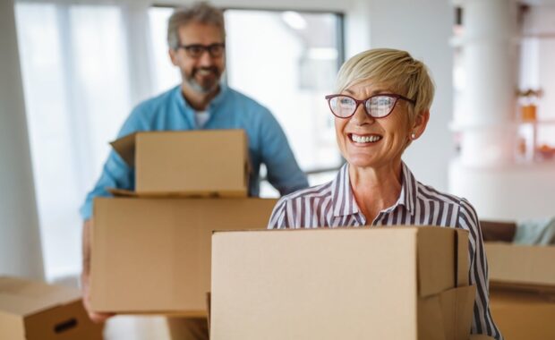 portrait of happy senior couple in love moving in new home