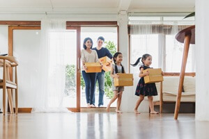 family moving to new home apartment with many packing boxes