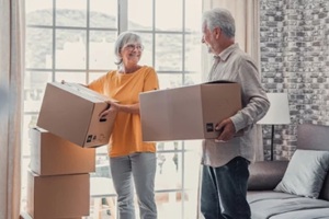 senior couple with packaging boxes