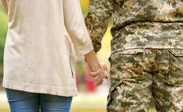 soldier reunited with wife, closeup