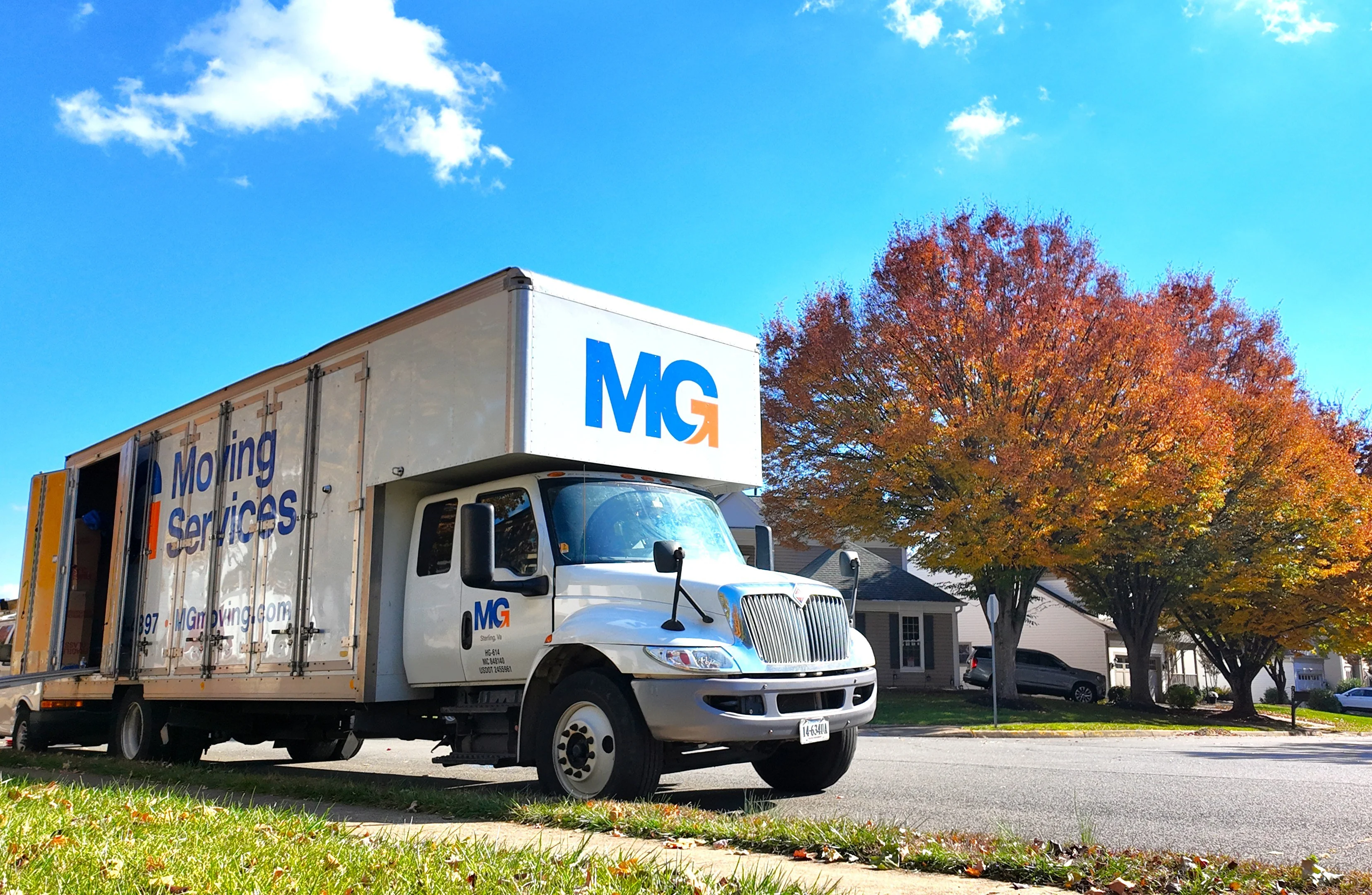 moving-truck-in-front-of-house